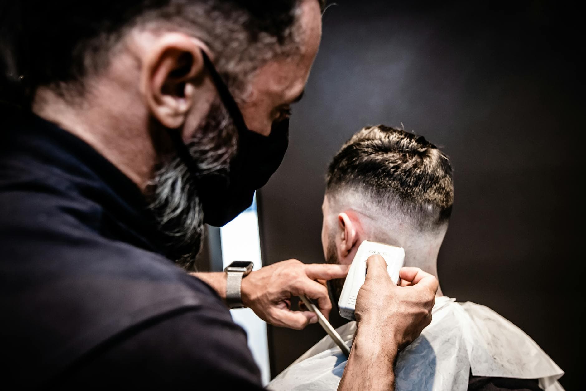 Barber giving a precise haircut